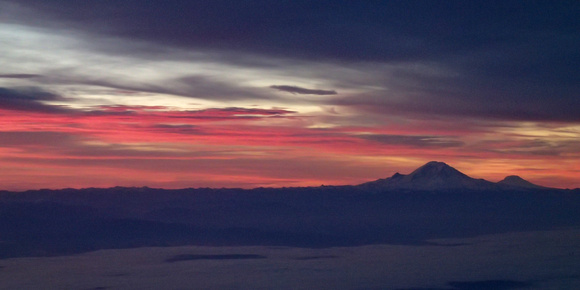 Sunrise clouds over BLI with Mount Baker on the horizon