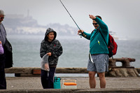 Angler with a Catch, Alcatraz at Background